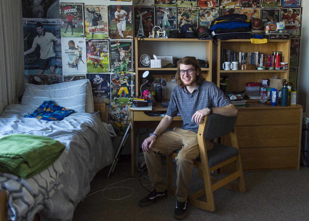 Kai Rowlands, 19, poses for a portrait in his dorm room at Marquette University in Milwaukee, on Sunday. Rowlands is an undergrad studying physics and Spanish.