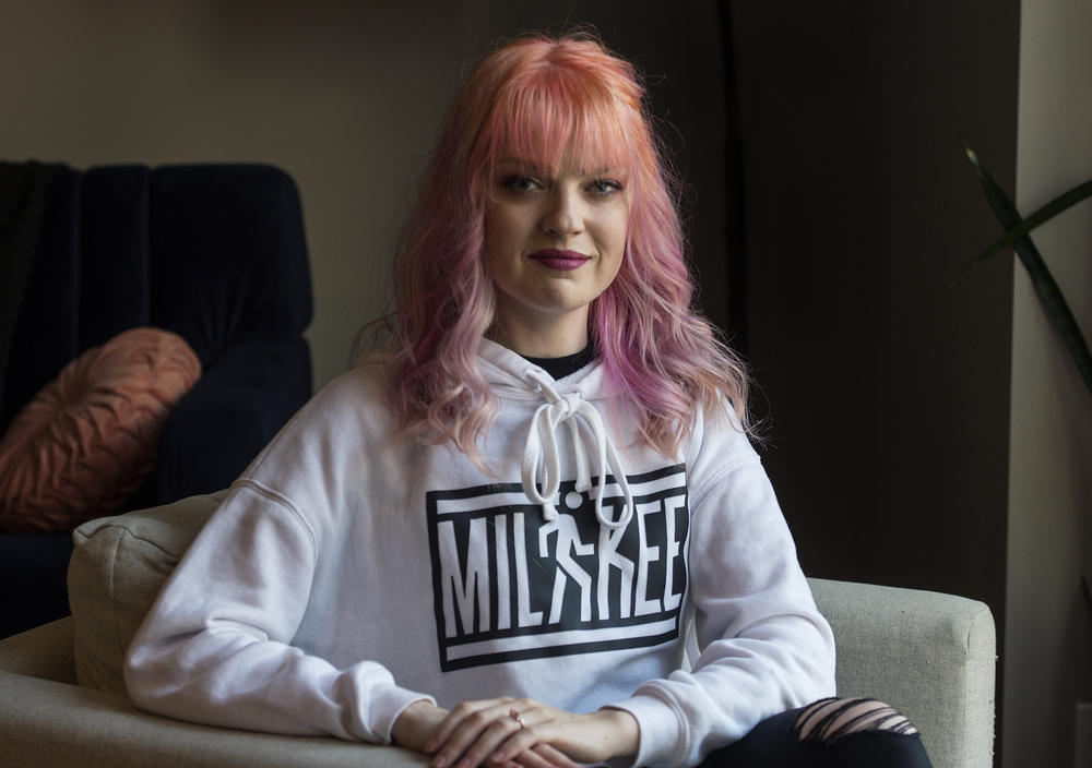 Kara Walla, 29, poses for a portrait in her home in downtown Milwaukee, on Sunday.