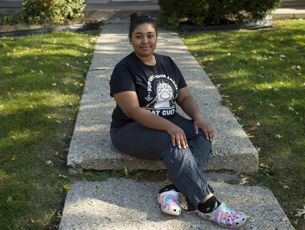 Melanie Medina, 20, poses for a portrait outside her apartment building in Greenfield, Wis., on Sunday. Medina works as a dental receptionist, and identifies as left leaning politically.