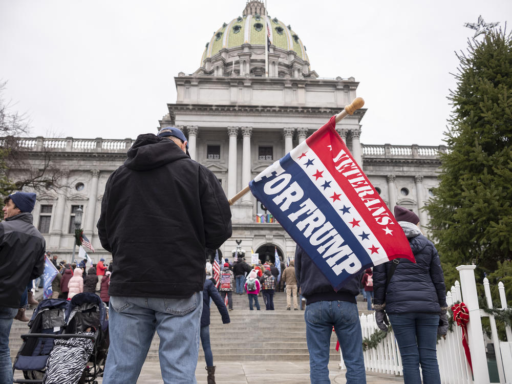 Supporters of then-President Donald Trump gather on the steps of the state Capitol on Jan. 5, 2021, in Harrisburg, Pa.