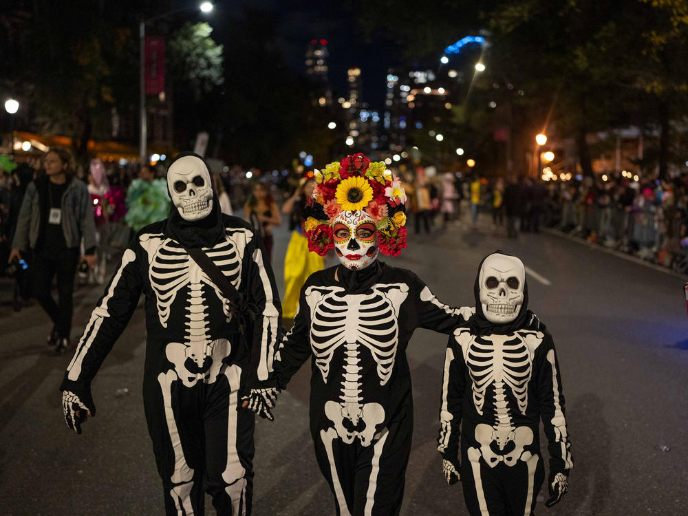 Halloween revelers dressed in costumes march in New York City's 48th annual Greenwich Village Halloween Parade, Sunday, Oct. 31, 2021, in New York.