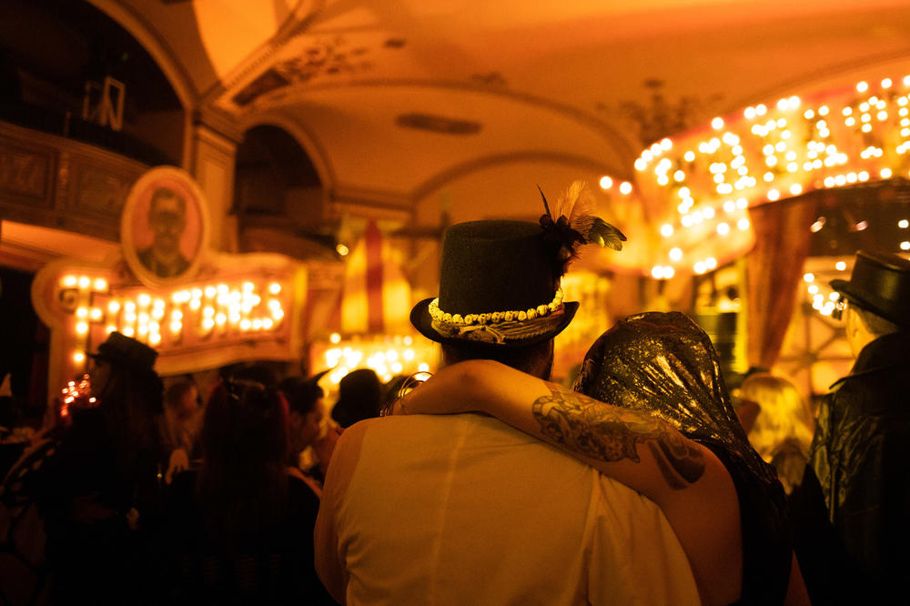 A couple watches performers during Theatre Bizarre.