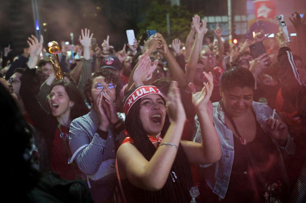 Supporters of candidate Luiz Inácio Lula da Silva react as they watch the vote count of the legislative and presidential election in São Paulo, on Oct. 2.