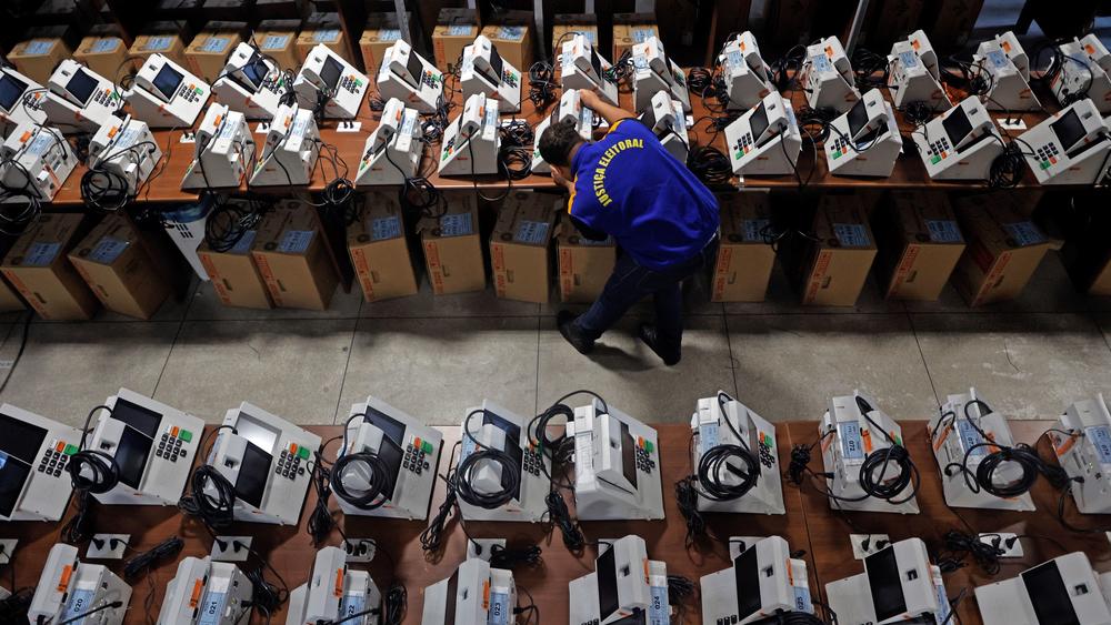 A Brazilian election official reviews electronic ballot boxes in Curitiba, Brazil, on Oct. 18, ahead of the second round of the presidential election on Sunday.