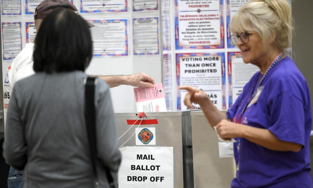 Voters deposit their mail ballots at Desert Vista Community Center in Las Vegas on Oct. 22. Mail voting, which has increased for years, surged in 2020 during the early months of the pandemic. Nevada has since codified an expansion of mail voting.