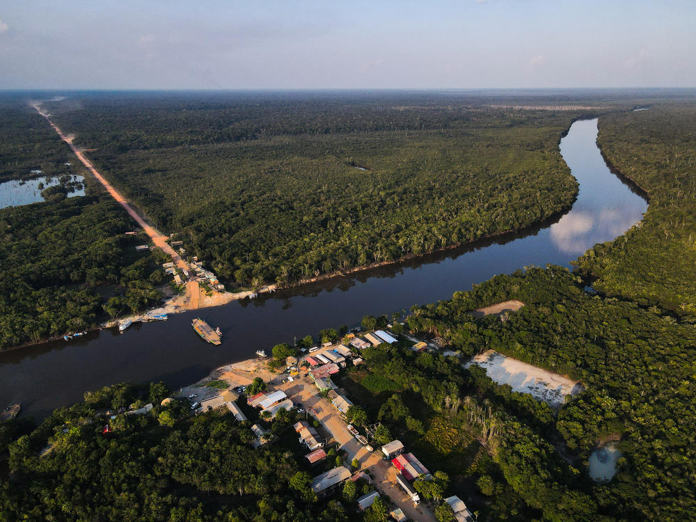 An aerial view of the BR-319 highway where it meets the Igapó Açu River in São Sebastião, Brazil, on Sept. 24. The community is a stopping point for travelers and tourists.