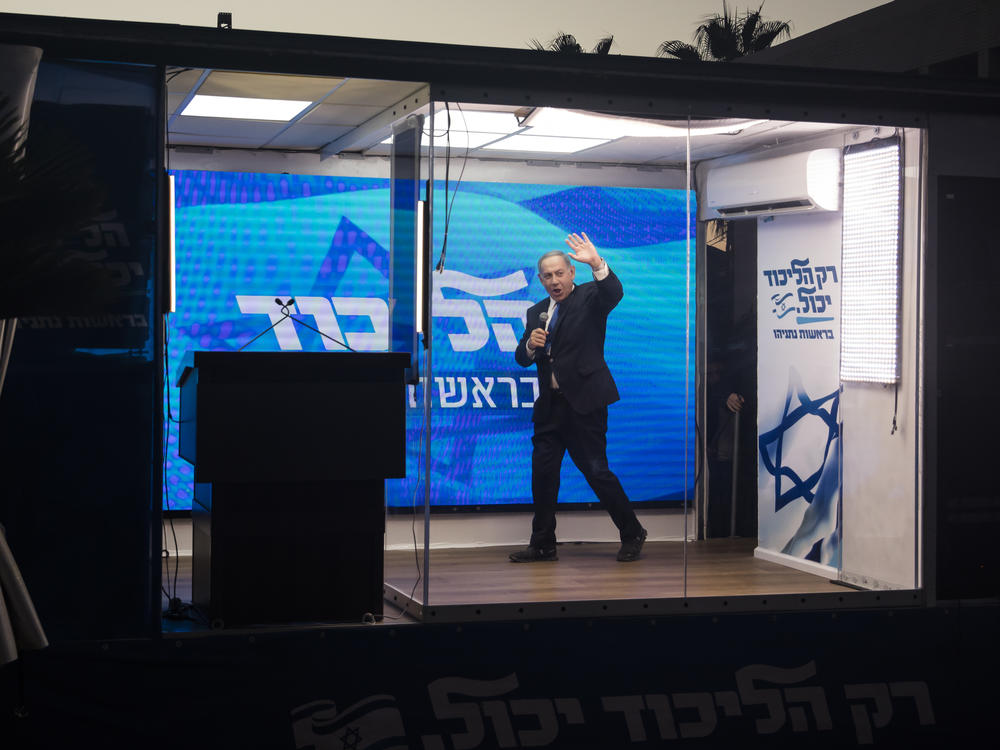 Former Israeli Prime Minister Benjamin Netanyahu speaks from a modified truck during a campaign event in Hadera, Israel, on Oct. 6. Israel will hold a national election Tuesday, after its coalition government collapsed in June.
