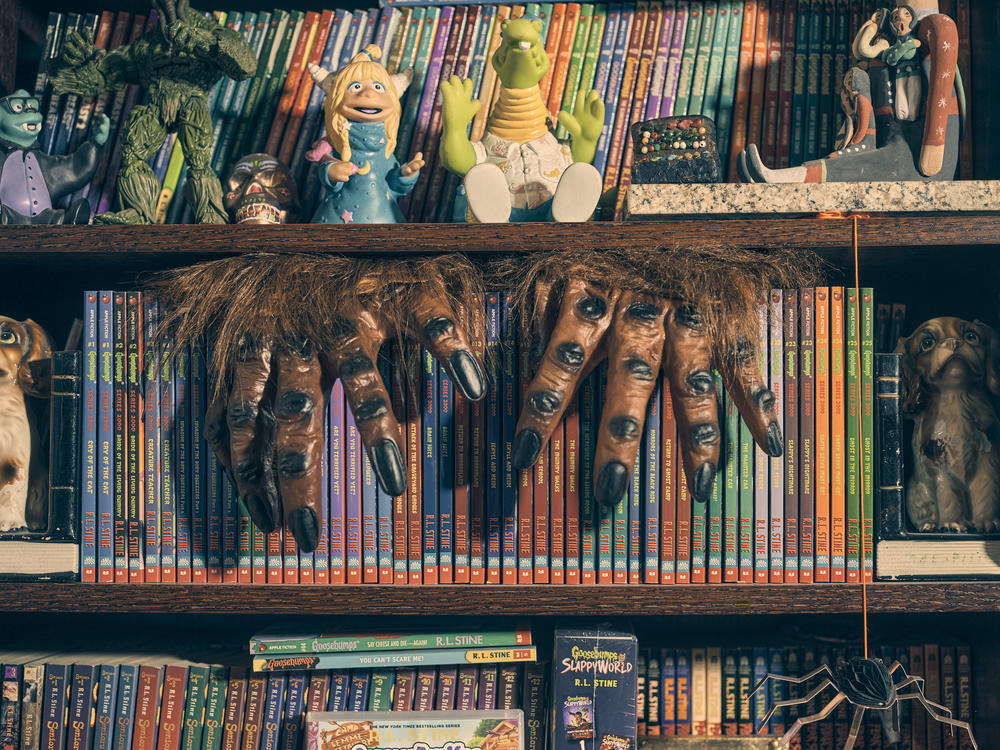 Bookshelves are filled with <em>Goosebumps</em> books and horror-based knick knacks in Stine's home.
