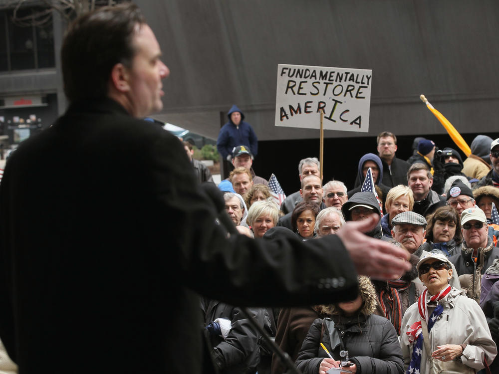 Conservative talk show host Dan Proft speaks to Tea Party supporters at a Tax Day rally in the Daley Center Plaza on April 18, 2011, in Chicago. Proft runs a political action committee and a network of news sites in Illinois to aid Republican candidates and causes.