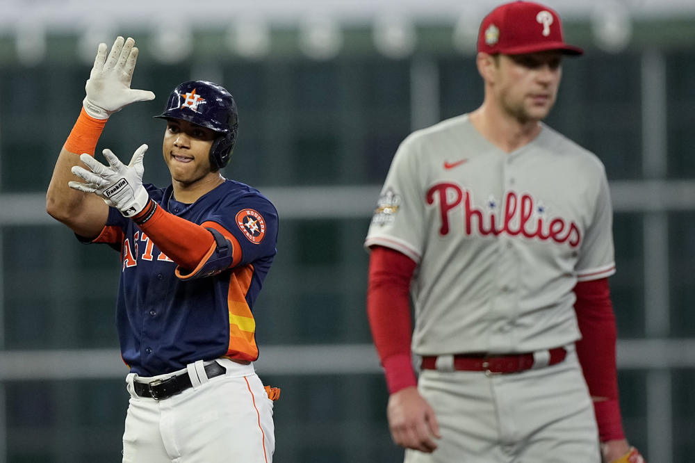 The Astros' Jeremy Peña celebrates his RBI-double during the first inning in Game 2 of the World Series between Houston and the Philadelphia Phillies on Saturday.