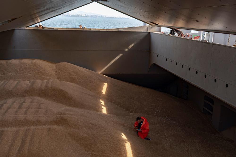 A crew member prepares a grain analysis for an inspection by members of the Joint Coordination Center onboard the Barbados-flagged ship, Nord Vind, coming from Ukraine loaded with grain and anchored in Istanbul, on Oct. 11.