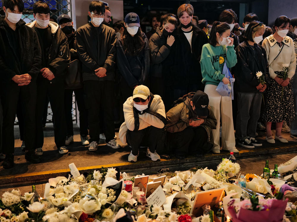 Mourners in the Itaewon neighborhood of Seoul pay tribute Monday to the victims of a deadly crowd crush that took place during Halloween celebrations Saturday night.