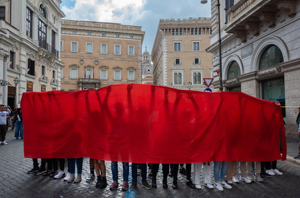 Afghans in Rome take part in a performance of Afghan artist Hamid Sultani's 