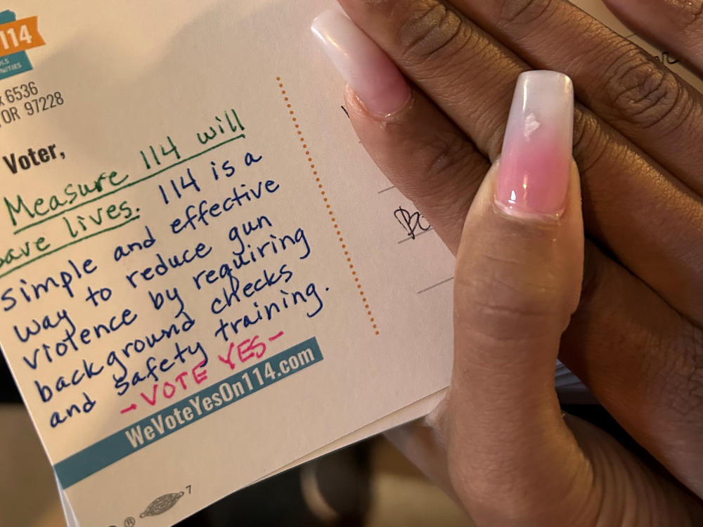 Volunteers working to pass an Oregon ballot measure that would require gun permits estimate they sent 10,000 handwritten postcards to voters in a period of a few days.