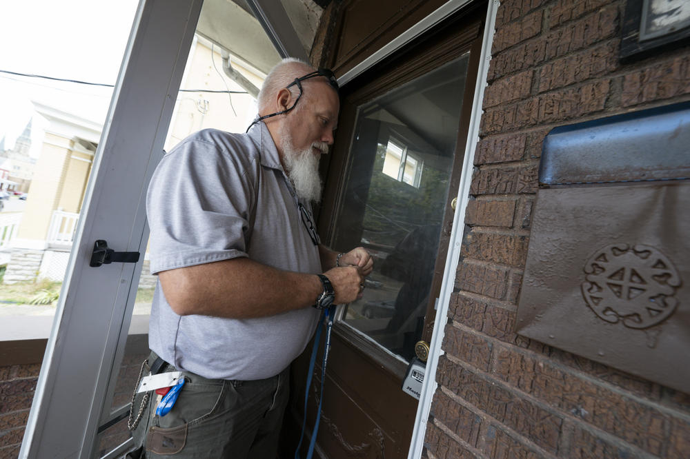 Ron Shouse is facilities manager with The Port of Greater Cincinnati, in charge of rehabbing 194 homes the agency bought after an investor landlord went under. He enters one of the homes that had been vacant but is now ready to rent or sell.