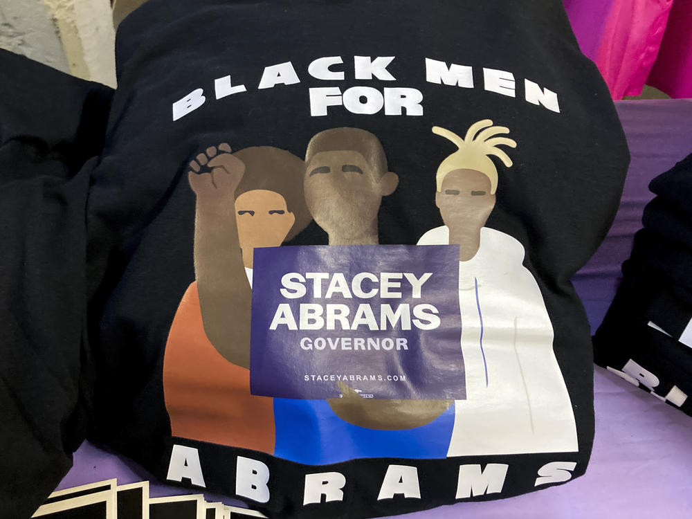 Free T-shirts are displayed for supporters of Georgia Democratic candidate for governor Stacey Abrams during a campaign event to appeal to Black men in her race against Republican incumbent Brian Kemp.