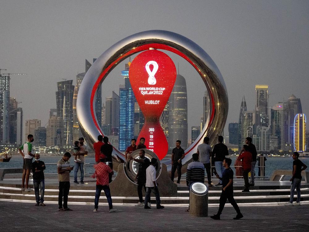 People gather in November 2021 around the official countdown clock showing remaining time until the kick-off of the World Cup 2022 in Doha, Qatar.