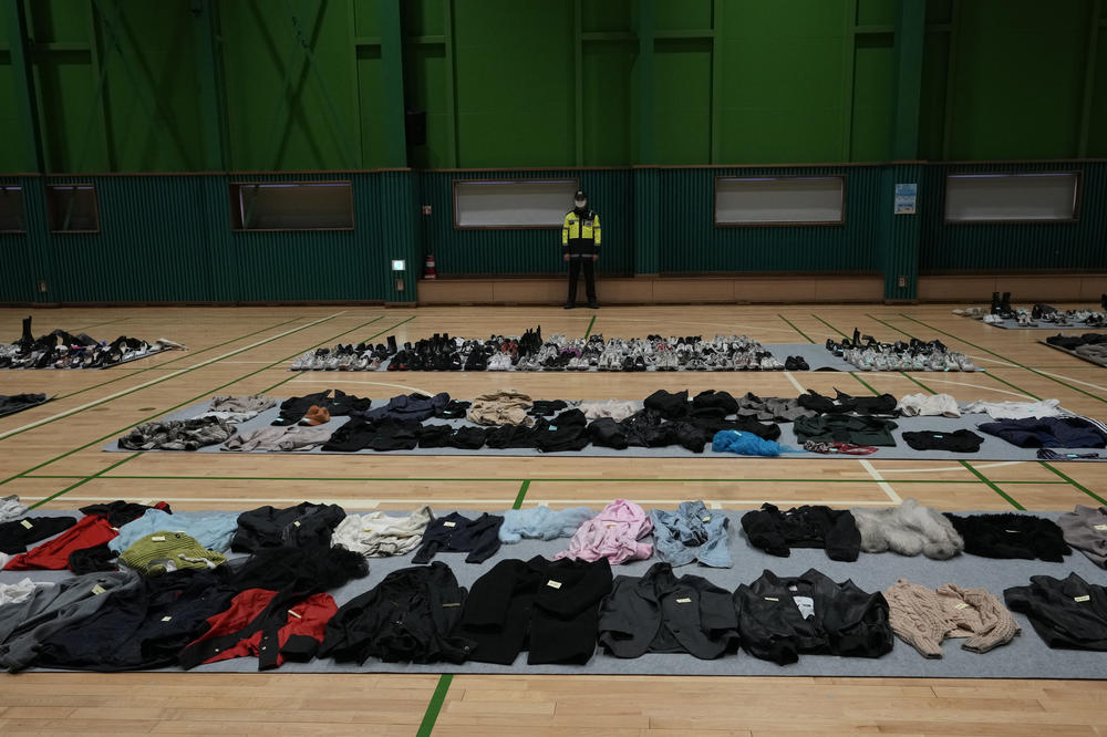 Clothes collected from the scene of a deadly accident following Saturday night's Halloween festivities are placed at a temporary lost and found center at a gym in Seoul.