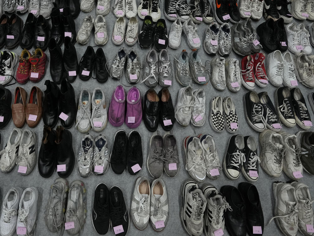 Shoes are seen at a temporary lost and found center in Seoul on Tuesday. They were among a huge collection of items found following Saturday night's deadly crowd surge.