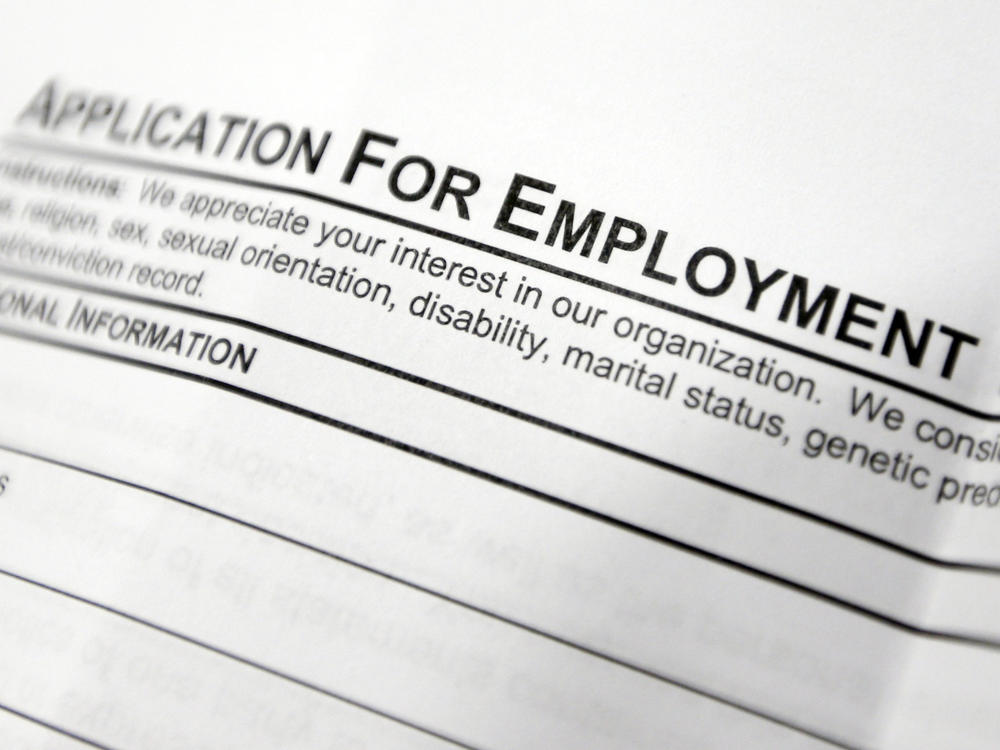 This April 22, 2014, file photo shows an employment application form on a table during a job fair at Columbia-Greene Community College in Hudson, N.Y.