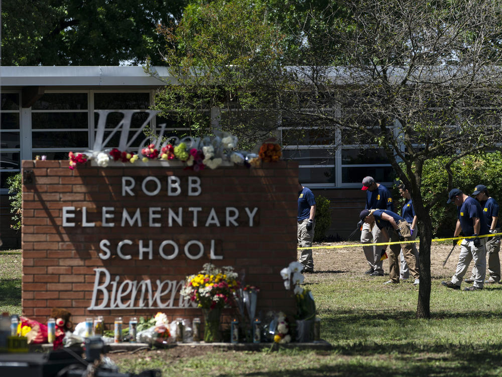Investigators search for evidence outside Robb Elementary School in Uvalde, Texas, May 25, 2022, after an 18-year-old gunman killed 19 students and two teachers. Four months after the Robb Elementary School shooting, the Uvalde school district on Friday, Oct. 7 pulled its entire embattled campus police force off the job.