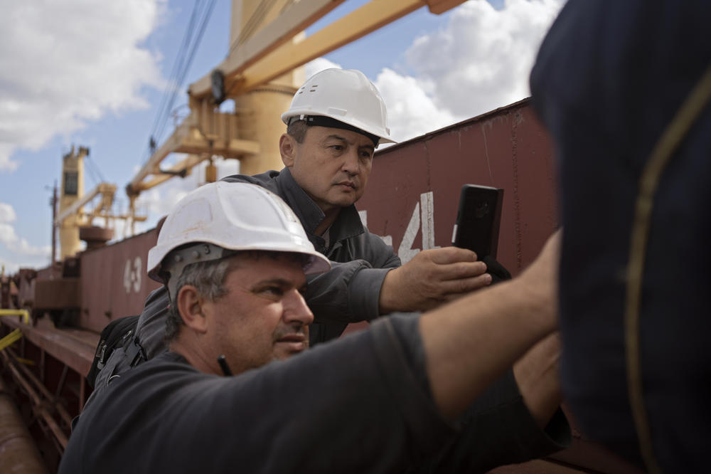 U.N. inspector Shamil Berdaliev, right, photographs the inspection of the Tzarevich. 