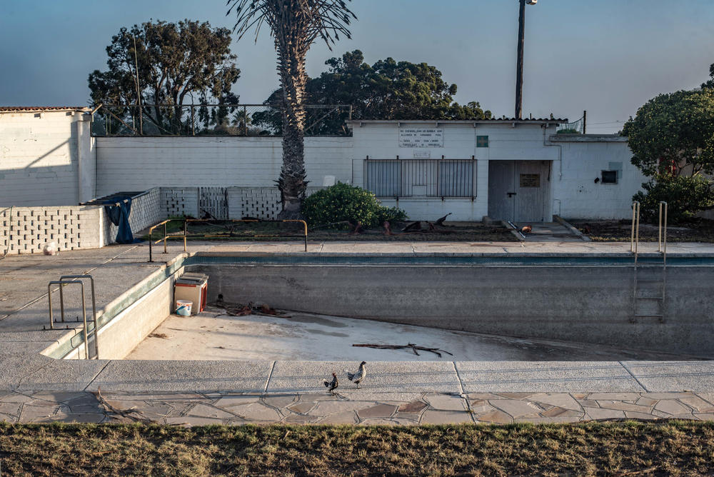 A swimming pool lies empty in the town of Kleinzee in the Namaqualand region of South Africa. The town was once the property of the De Beers diamond company. In its heyday, it was a thriving settlement of 4,000 people with about 30 recreational clubs. After closing down its mines in the region, De Beers sold off the town, which is now largely empty.