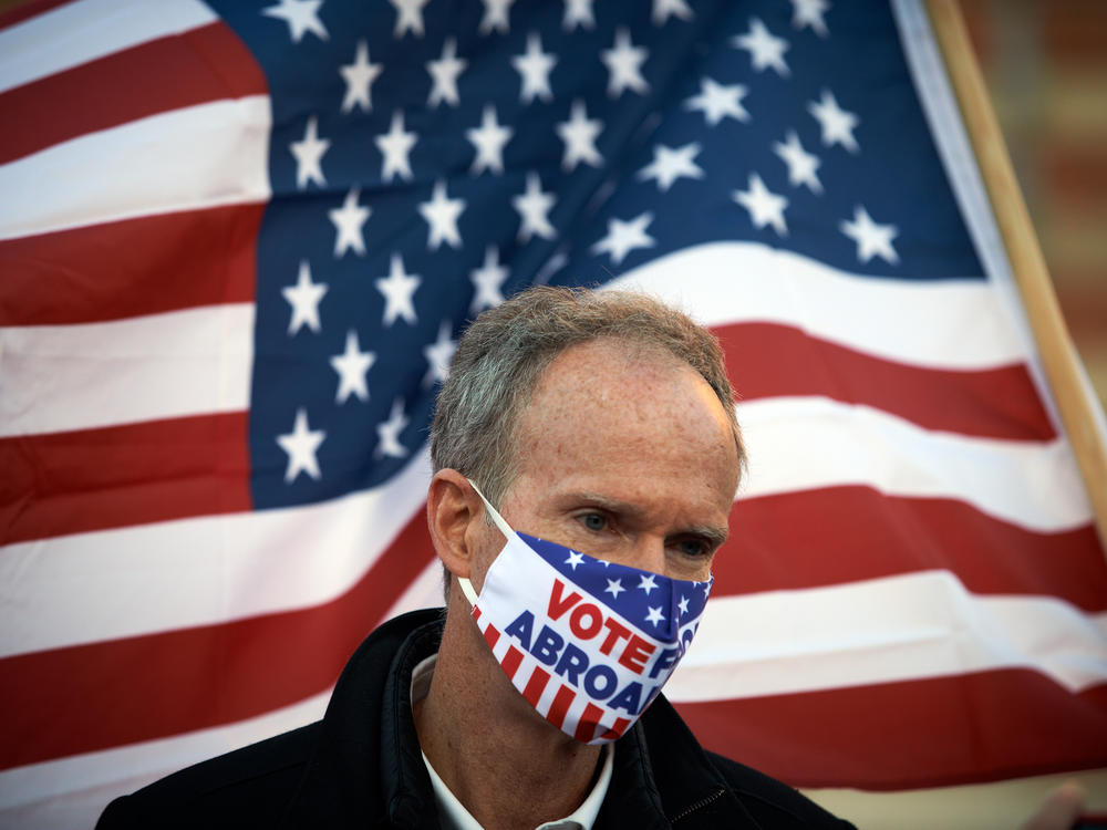 American voters living abroad assembled in Toulouse, France, in January 2021 to pay tribute to Americans who died from COVID-19 and to support then-President-elect Biden ahead of his inauguration.