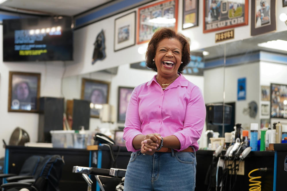 Democratic Senate candidate Cheri Beasley speaks with potential voters at a hair salon in Charlotte, N.C., in September.