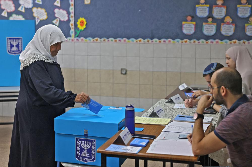 An Arab Israeli voter casts her ballot at a polling station in the northern Israeli village of Maghar on Tuesday.
