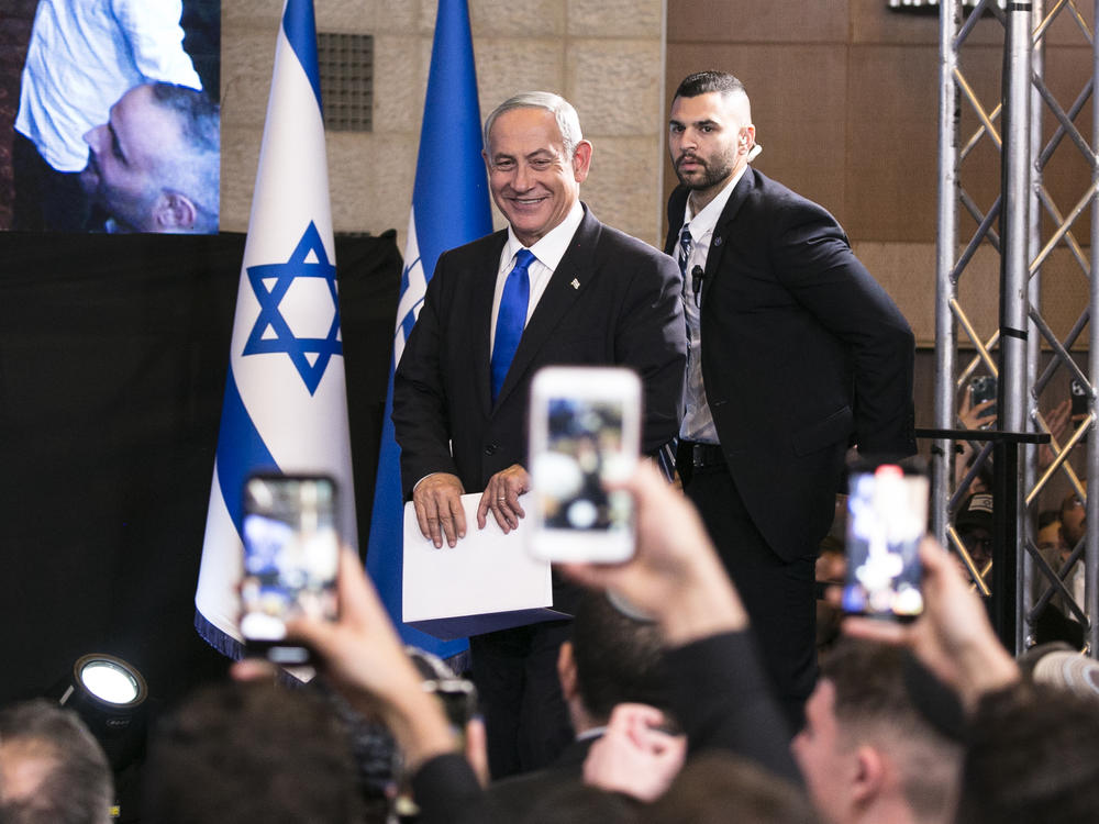 Likud leader Benjamin Netanyahu enters an election night event in Jerusalem on Monday.