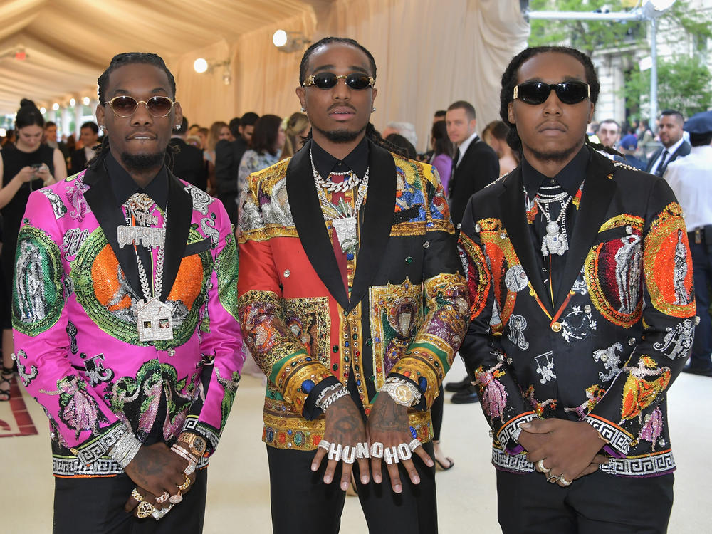 Rappers Offset (from left), Quavo and Takeoff of the group Migos appear at a Met gala in 2018. Kirshnik Khari Ball, known professionally as Takeoff, died early Tuesday morning after gunshots were fired at a party in Houston.