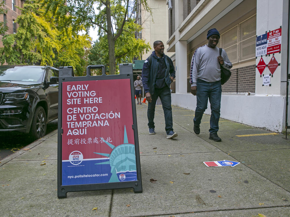 Signs indicate the location of an early voting polling site at Frank McCourt High School on the Upper West Side of Manhattan in New York City on Tuesday, November 1, 2022.