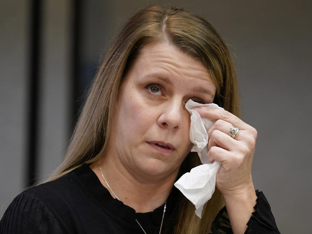 Gabby Petito's mother Nichole Schmidt, wipes a tear from her face during a news conference Thursday, Nov. 3, 2022, in Salt Lake City. Gabby Petito's family filed a wrongful death lawsuit alleging that police failed to recognize their daughter was in a life-threatening situation last year when officers investigated a fight between her and her boyfriend.