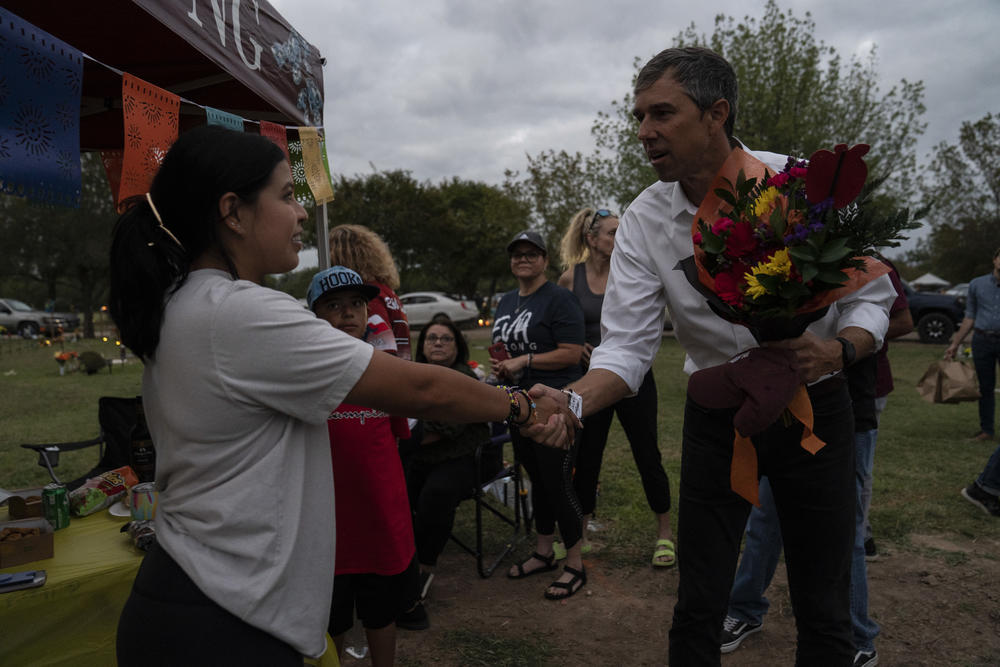 Adalynn C. Ruíz, 23, shakes Texas Democratic gubernatorial candidate Beto O'Rourke's hand at Hillcrest Memorial Cemetery.