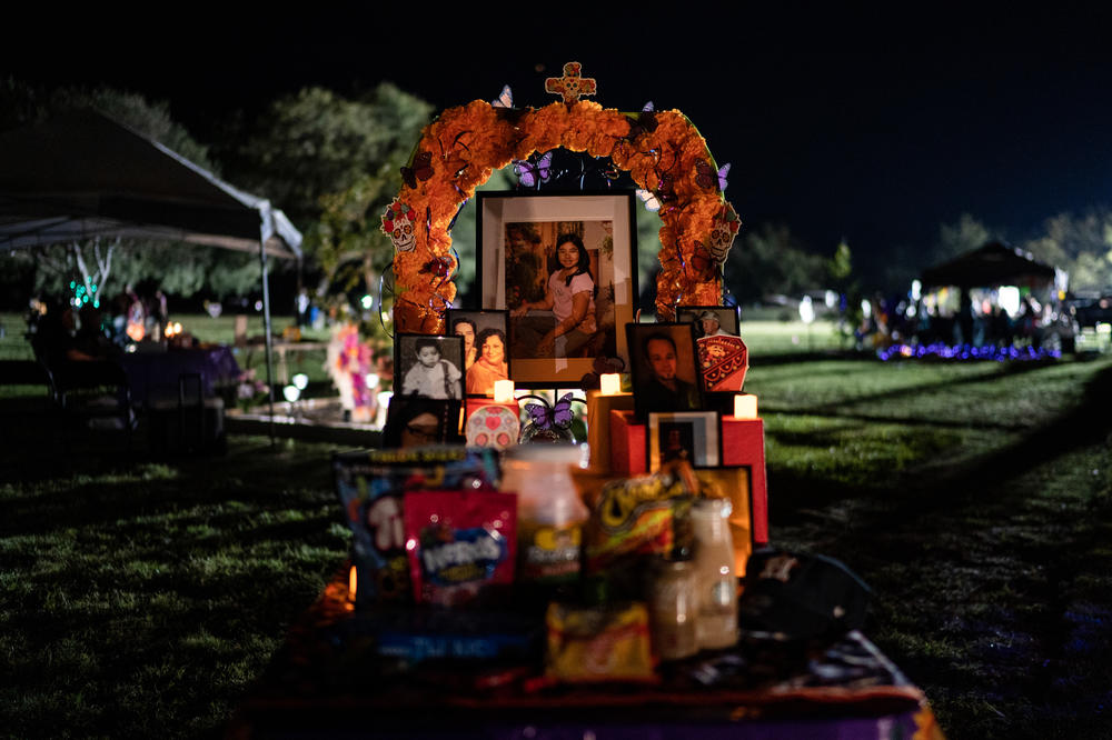 Tess Marie Mata's altar along with other family member's pictures at Hillcrest Memorial Cemetery.