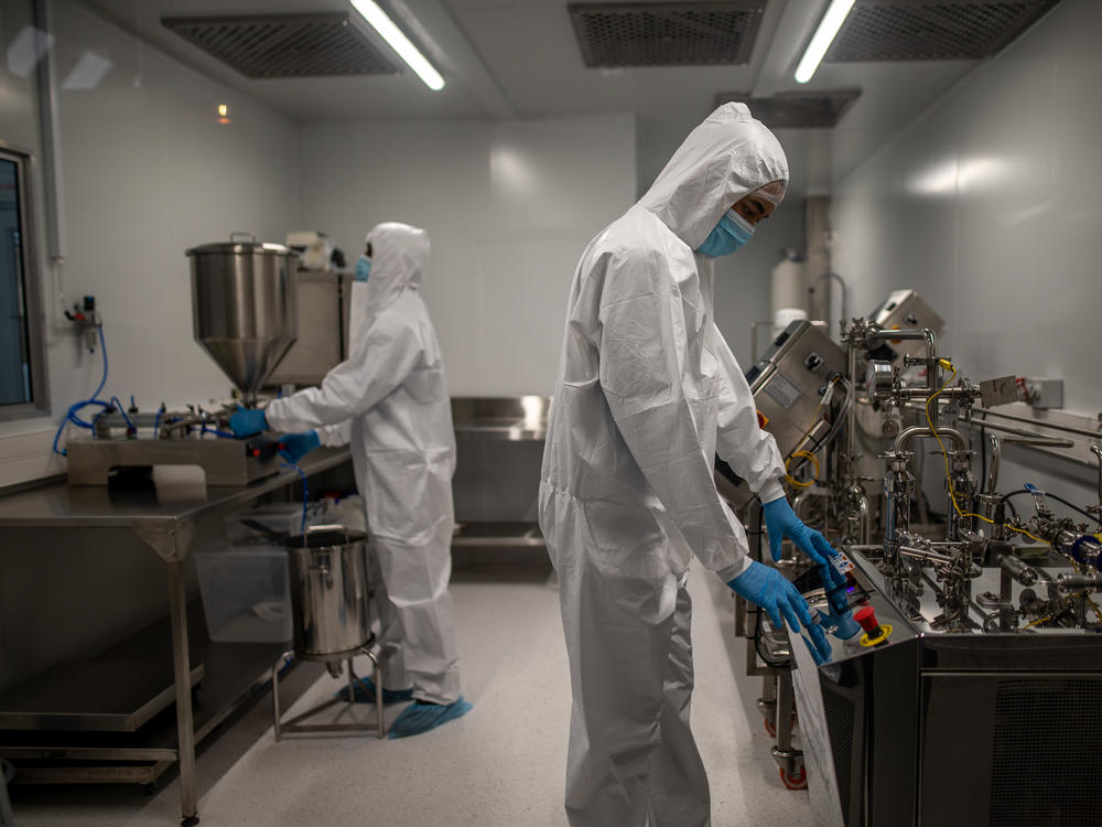 Afrigen Biologics staff members in the company's lab in Cape Town, South Africa. Afrigen is working on a project to figure out how to manufacture the Moderna COVID-19 vaccine â part of an effort to address global health inequities.