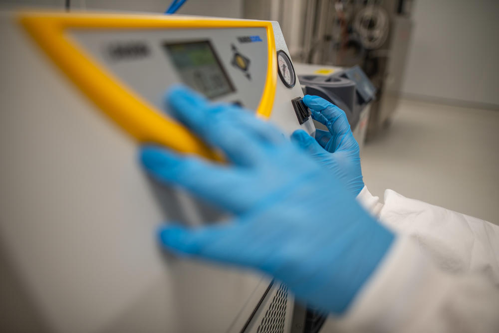 An Afrigen staff member inspects equipment in the bioreactor room in the company's facility. The South African lab is working on a project to replicate Moderna's COVID vaccine.