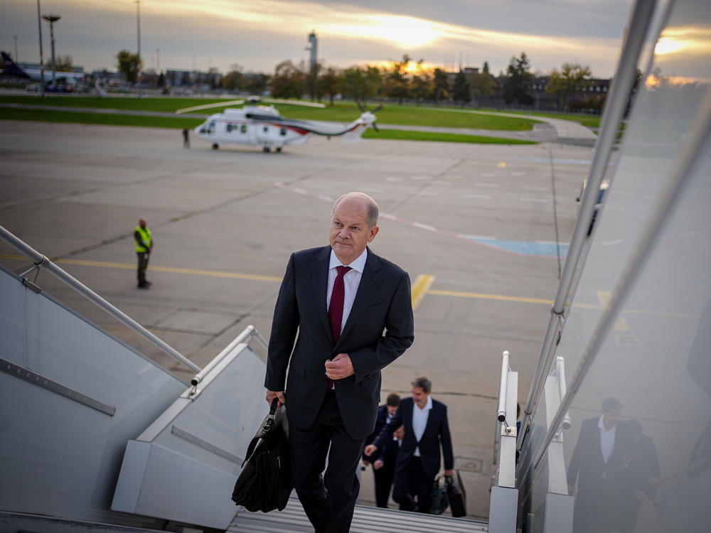 German Chancellor Olaf Scholz arrives at Berlin-Brandenburg Airport for his flight to China on Thursday.