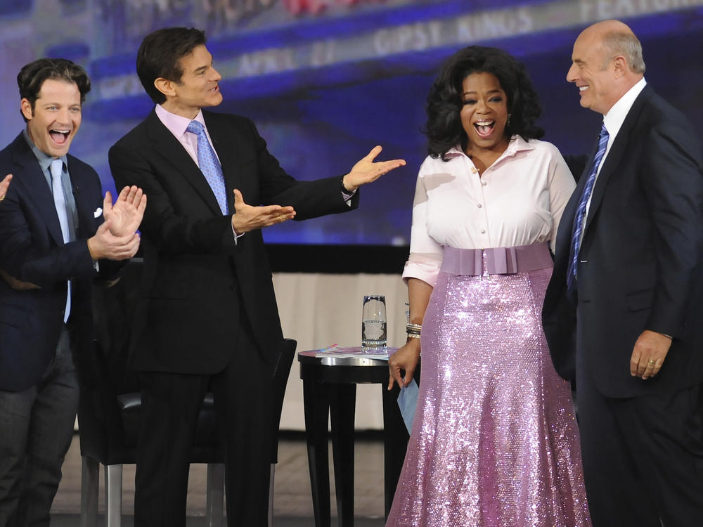 Talk-show host Oprah Winfrey is seen with interior designer Nate Berkus, left, Dr. Mehmet Oz and Dr. Phil McGraw, right, during 