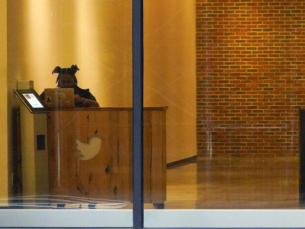 A receptionist works Oct. 26 in the lobby of the building that houses the Twitter office in New York.