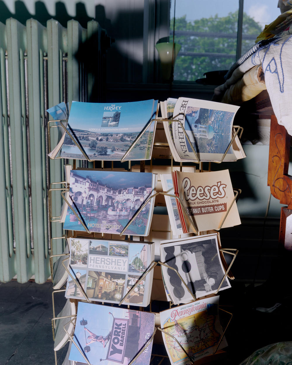 A rack of postcards from Hersheypark, the theme park in Hershey, Pa., inside Brown's home.