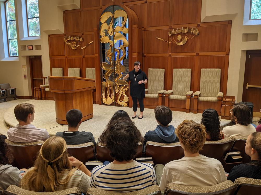 Rabbi Eliana Fischel addresses a group of American University students in October. She tells NPR that the national rise in antisemitism is prompting many congregants to change their behavior.