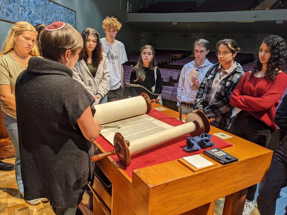 Rabbi Fischel shows a Torah scroll to American University students in October.