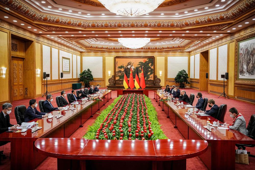 Visiting German Chancellor Olaf Scholz and members of his delegation attend a meeting with Chinese Premier Li Keqiang at the Great Hall of the People in Beijing on Friday.