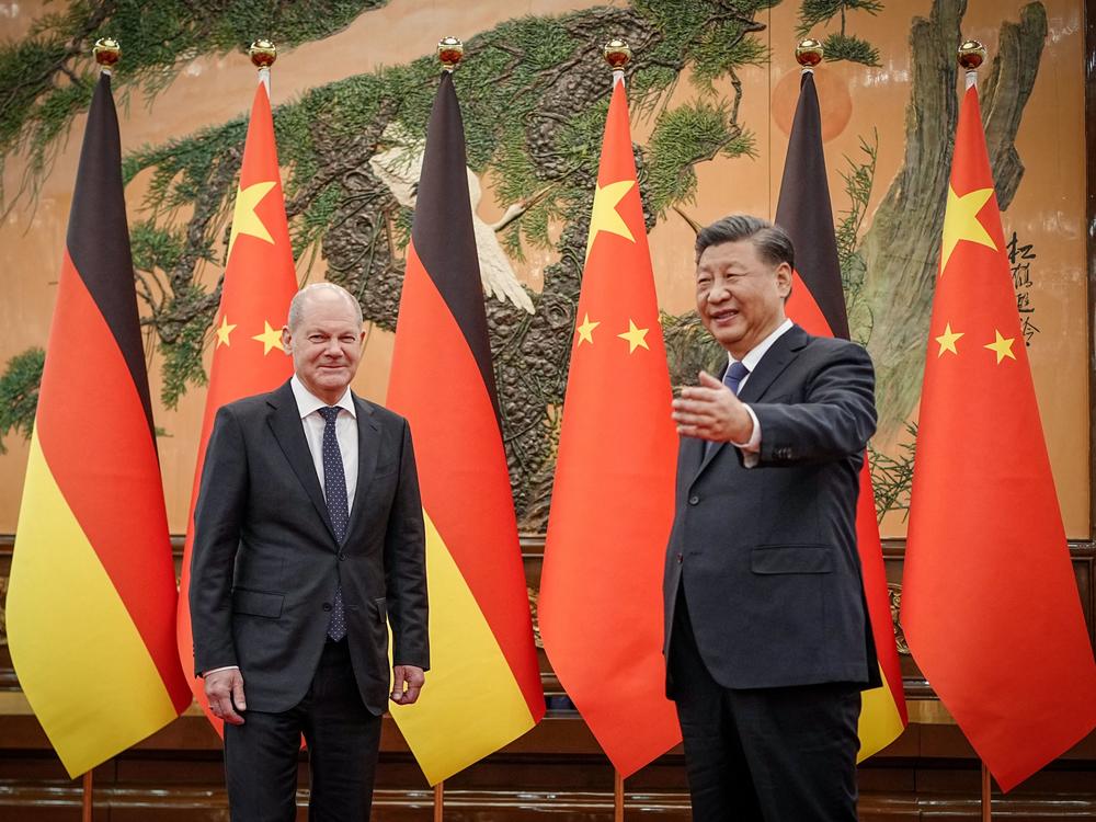 Chinese President Xi Jinping, right, welcomes German Chancellor Olaf Scholz at the Great Hall of the People in Beijing on Friday.