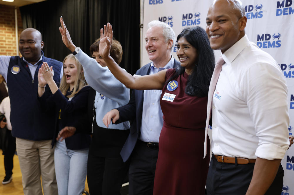 Maryland Democratic gubernatorial nominee Wes Moore joins Democratic National Committee Chair Jamie Harrison (L), Sen. Chris Van Hollen (D-MD) and lieutenant gubernatorial nominee Aruna Miller (2nd R) during a campaign rally at the Stamp Student Union on the campus of the University of Maryland on October 26, 2022 in College Park, Maryland.