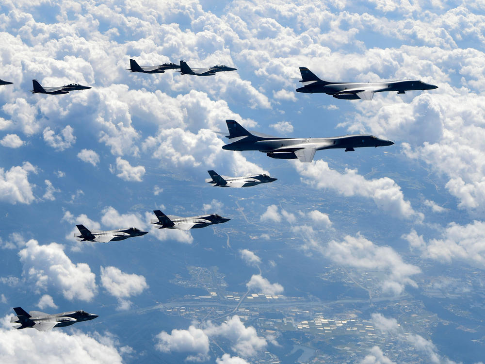 In this file photo provided by South Korea Defense Ministry, U.S. Air Force B-1B bombers, F-35B stealth fighter jets and South Korean F-15K fighter jets fly over the Korean Peninsula during joint drills on Sept. 18, 2017.