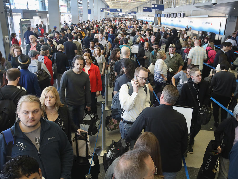 Passengers at O'Hare International Airport, in Chicago, wait in line to be screened at a Transportation Security Administration checkpoint in 2016.