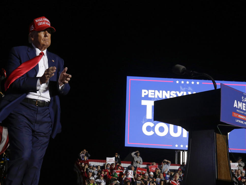 Former President Donald Trump applauds toward the crowd at the conclusion of an election rally in Latrobe, Pa., Saturday, Nov. 5, 2022.